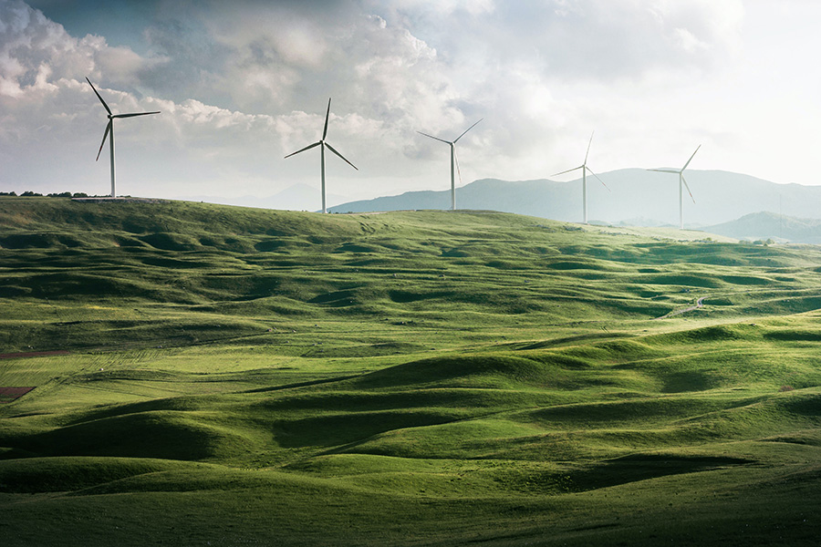 Windmills on green hills