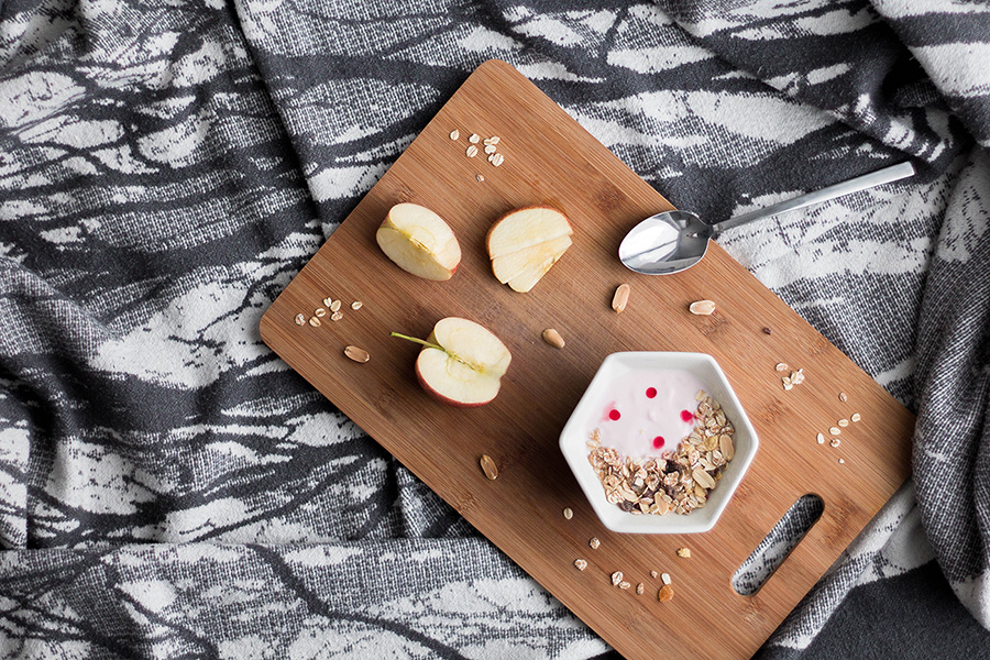 jar of yogurt on a wood tray