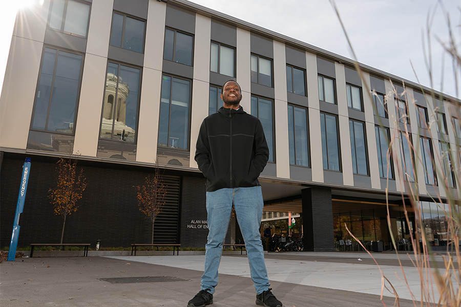 Marshal standing outside the new Scaife Hall on CMU's Pittsburgh campus.