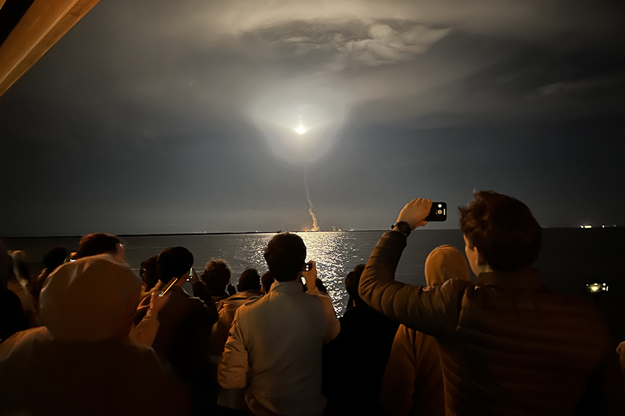 A rocket blasting into space from earth