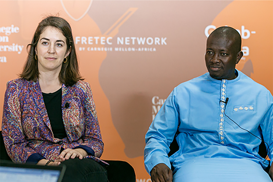 Assane Gueye and Giulia Fanti on stage at meeting