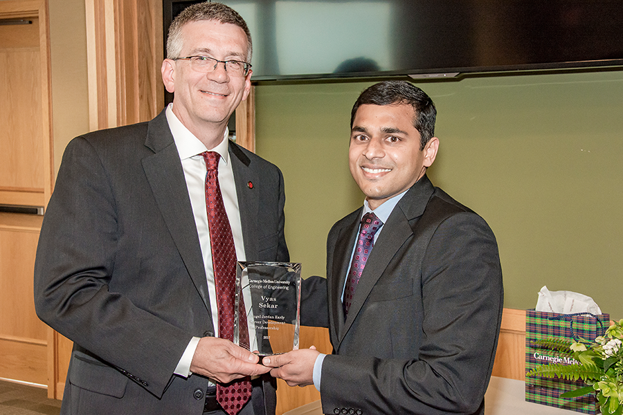 Sekar receiving the professorship award