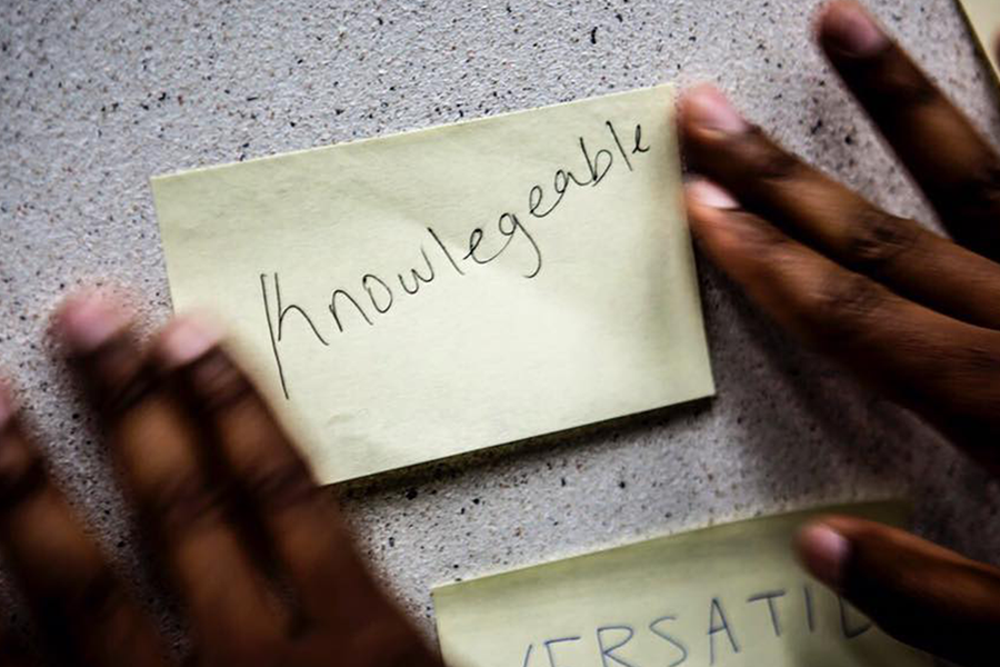 student with a post-it note