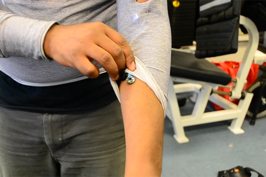student with arm sensor in the gym