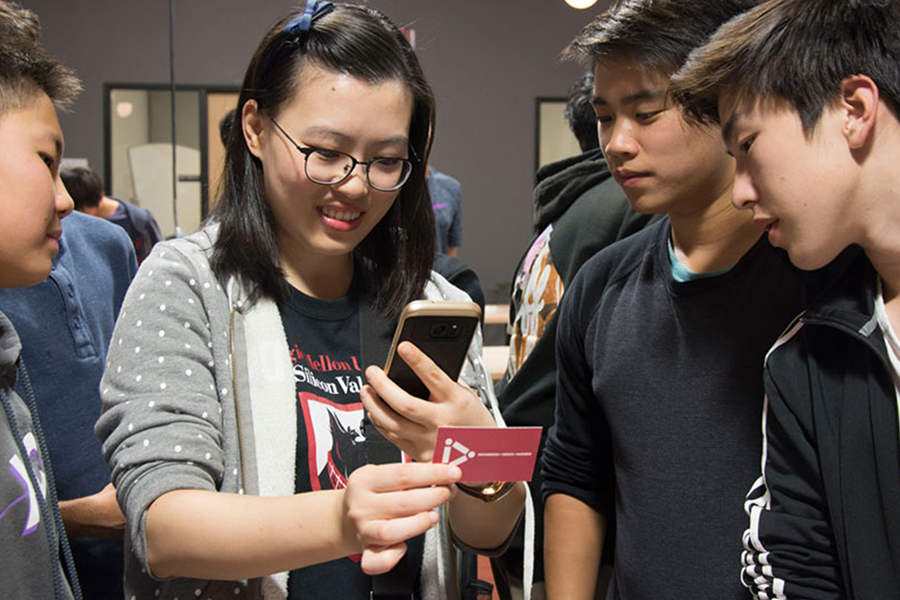 Students demonstrating a phone