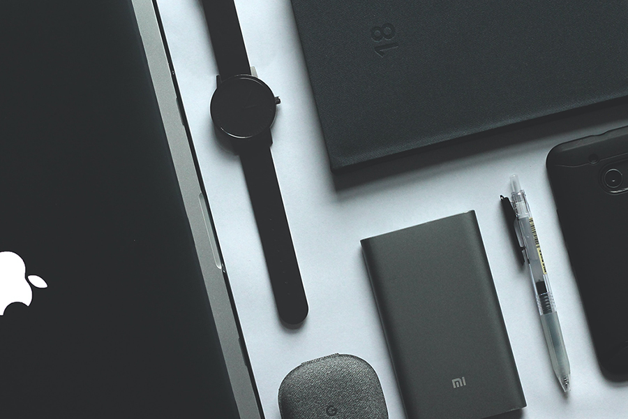 Black smart devices on a white table