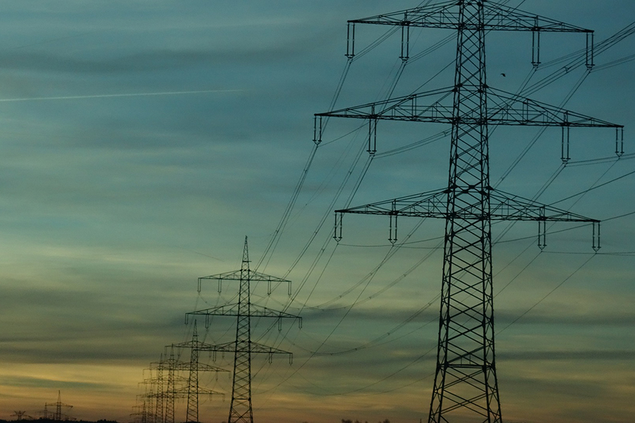 Power lines against a sunset