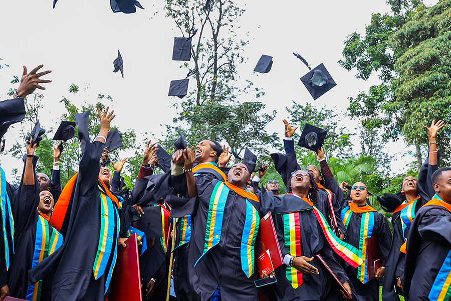 Graduates throwing caps in the air