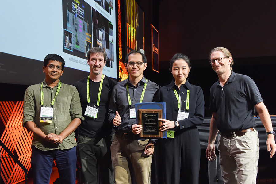 Researchers accepting award at conference