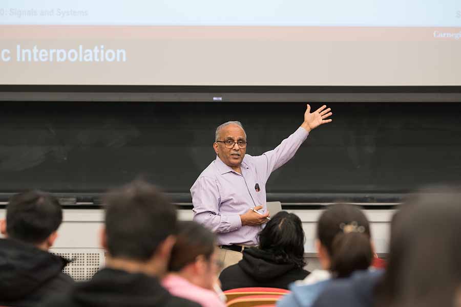 Kumar teaching in a classroom